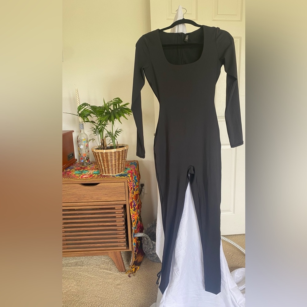 SKIMS black with back zipper long sleeve jumpsuit. Worn only once !